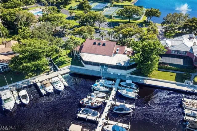 an aerial view of a house with swimming pool patio and outdoor seating