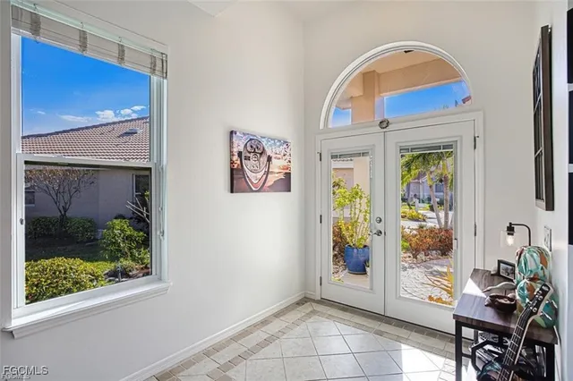 a view of an entryway with wooden floor and a potted plant