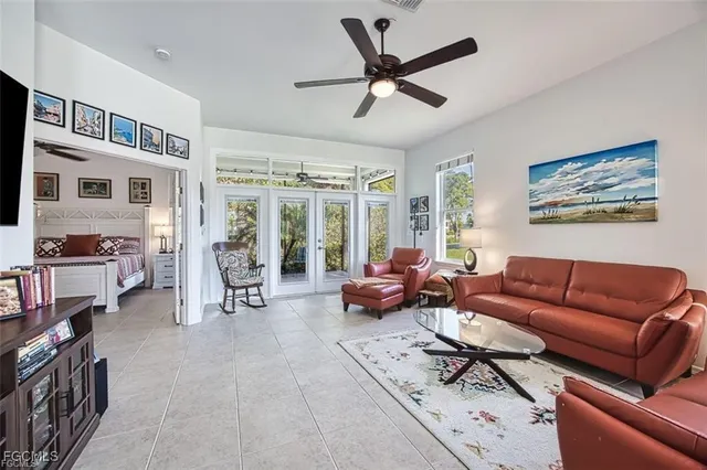 a living room with furniture and a book shelf