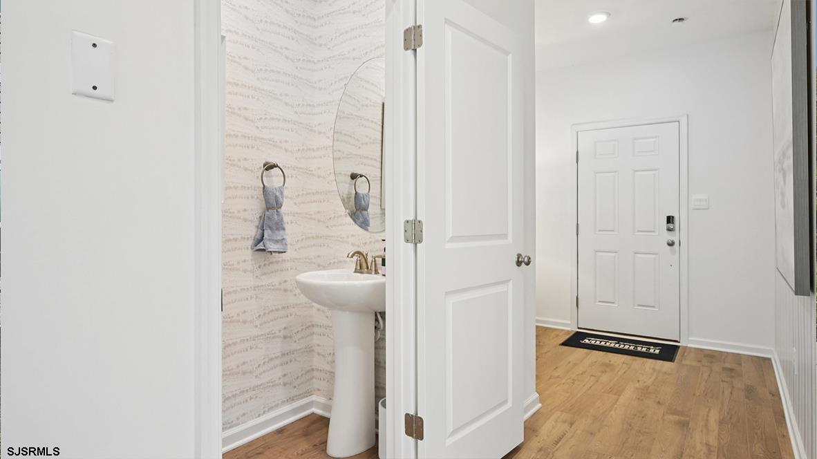 504 Scotty Boulevard, Unit 1203 Rio Grande, NJ 08242 - Photo 5 of 40 a bathroom with a granite countertop shower and a sink