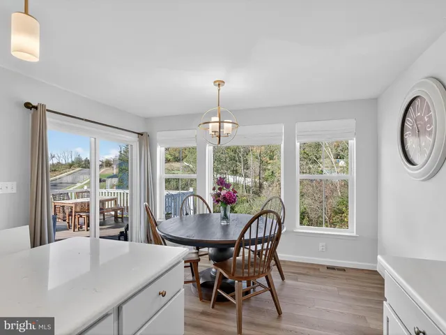 a view of a room with wooden floor and closet