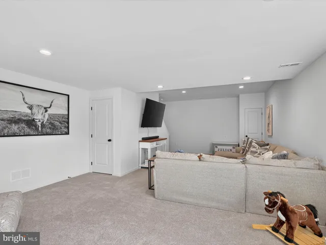a view of a hallway with closet and bathroom
