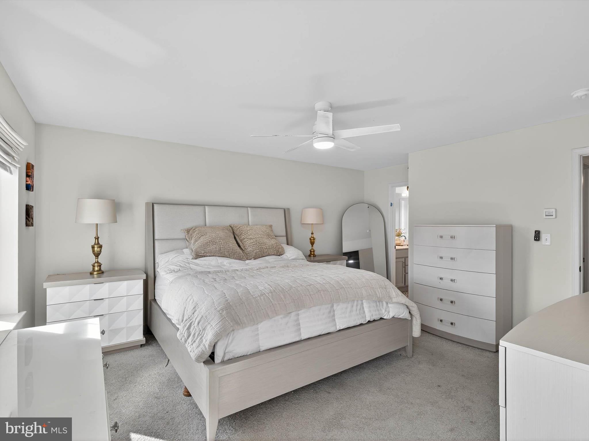 29 Ladderback Lane Reading, PA 19606 - Photo 31 of 60 a bedroom with a bed and a lamp on dresser