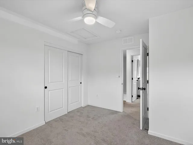 a bathroom with a sink toilet and a mirror