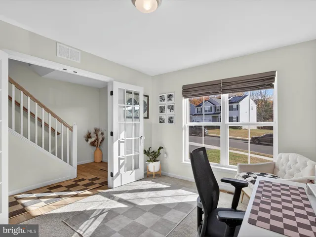 a large kitchen with a table and chairs