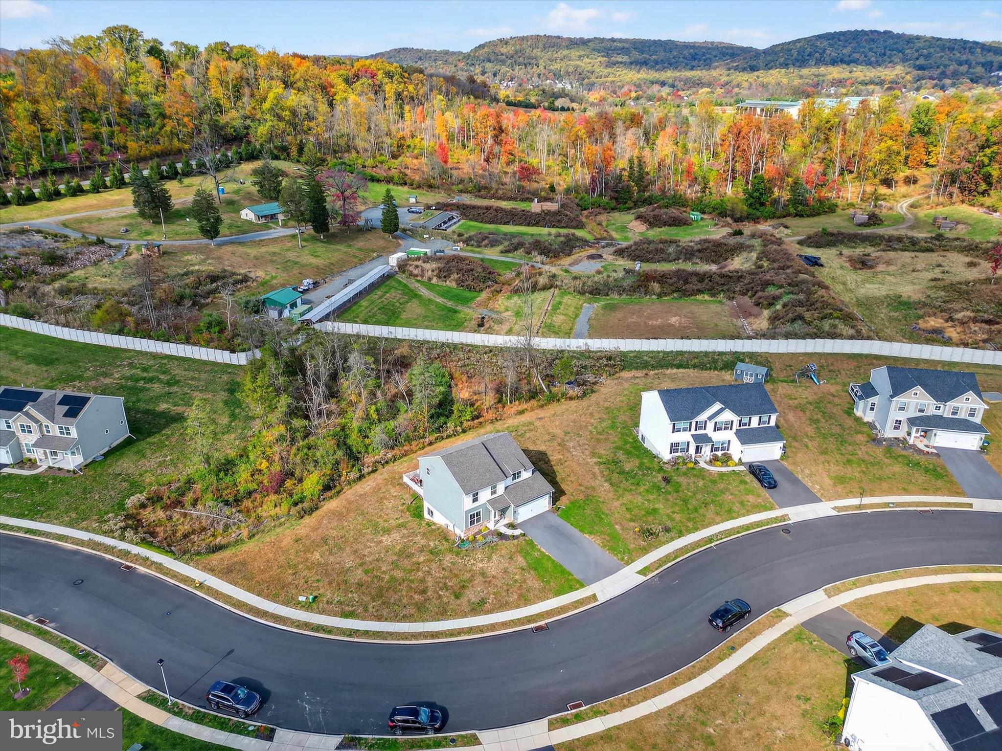 29 Ladderback Lane Reading, PA 19606 - Photo 49 of 60 a view of a swimming pool with a table and chairs