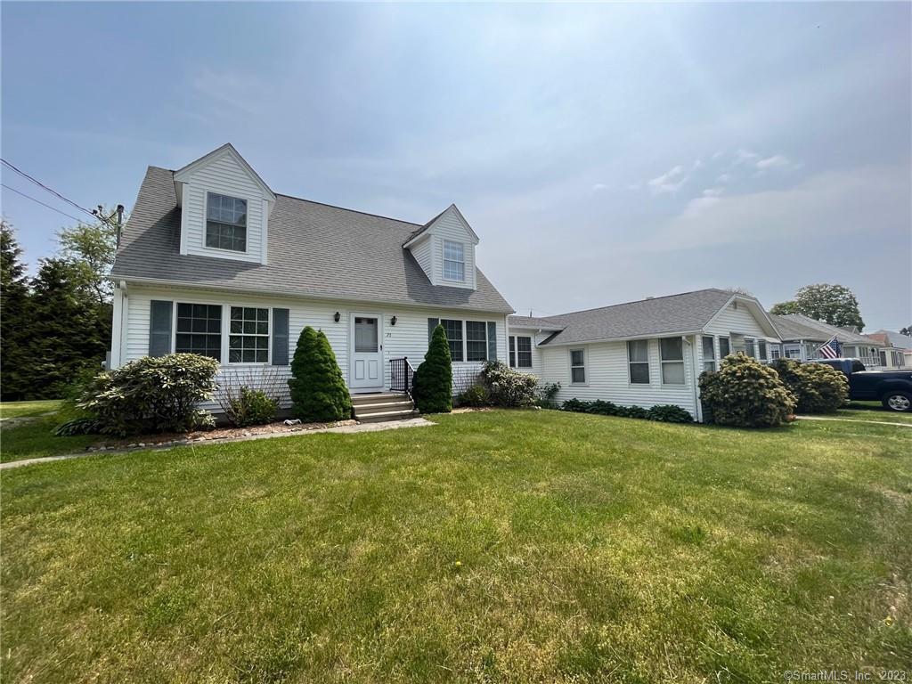 20 Portland Avenue Old Lyme, CT 06371 - Photo 1 of 37 a front view of a house with a yard and porch