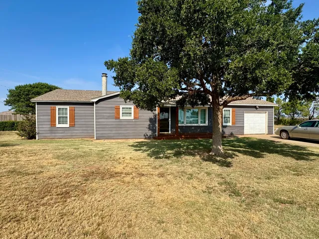 a house with trees in front of it