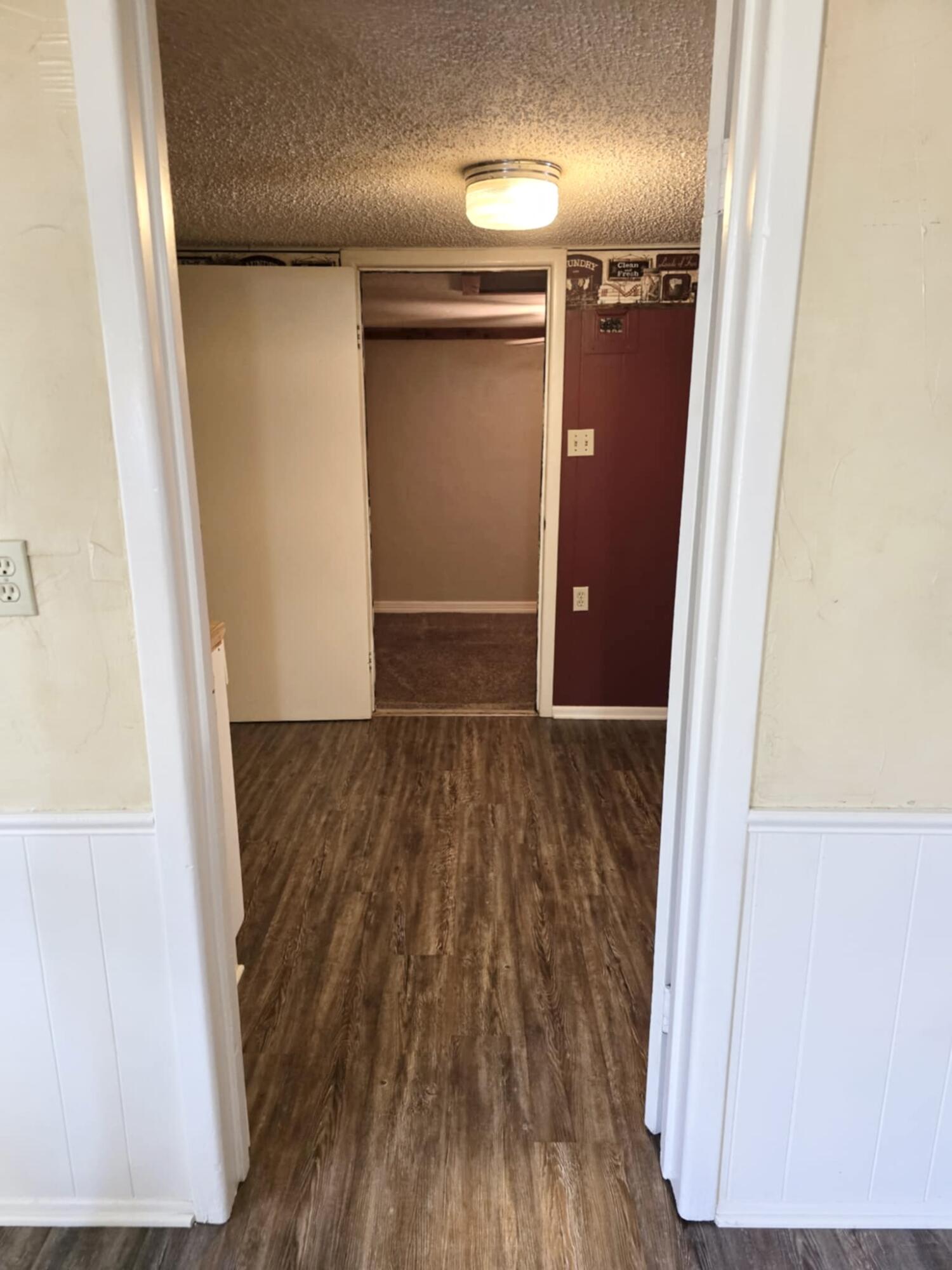 640 Fm 168 Olton, TX 79064 - Photo 16 of 30 a view of hallway with wooden floor