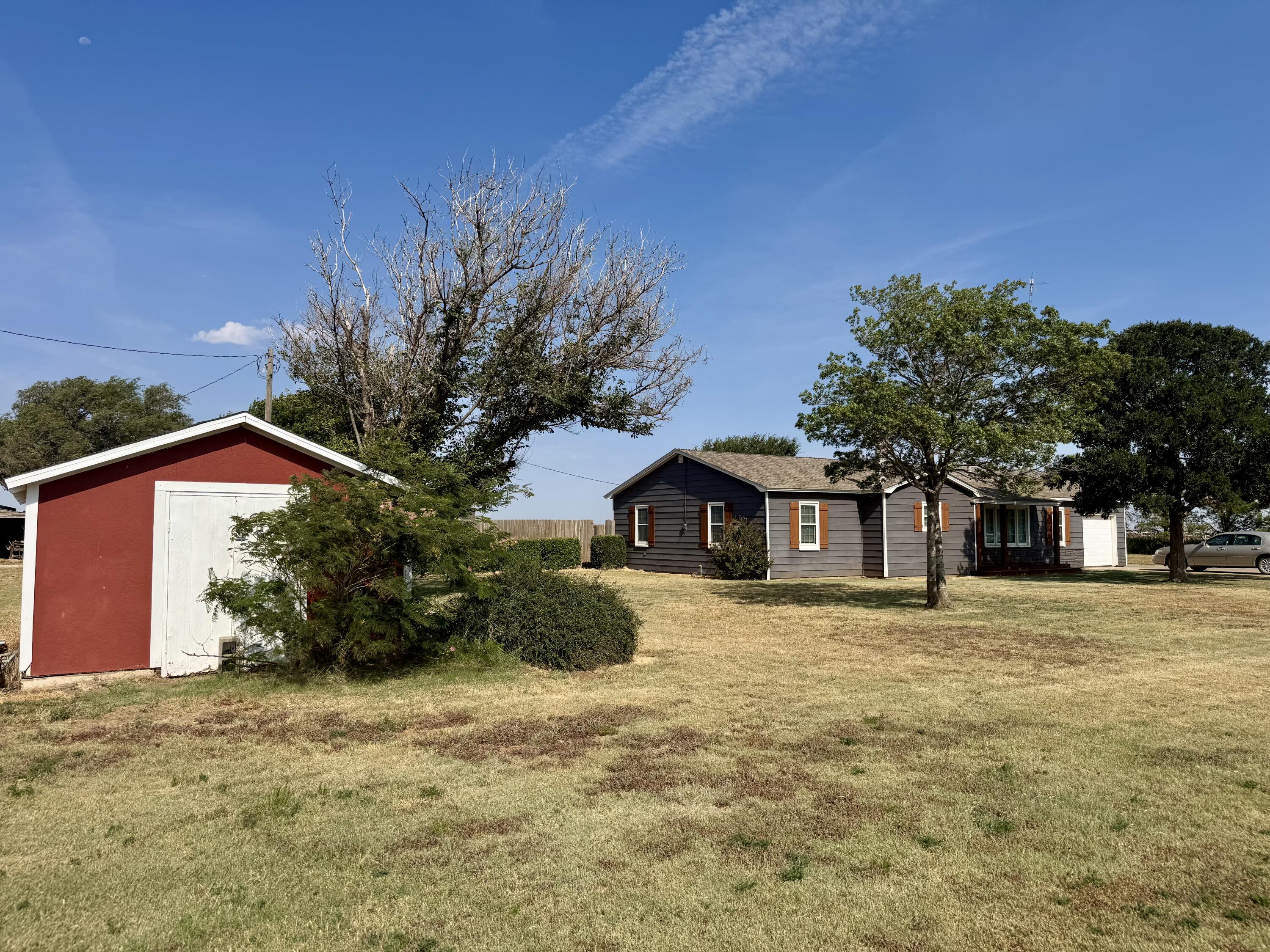640 Fm 168 Olton, TX 79064 - Photo 29 of 30 a front view of a house with a yard and garage
