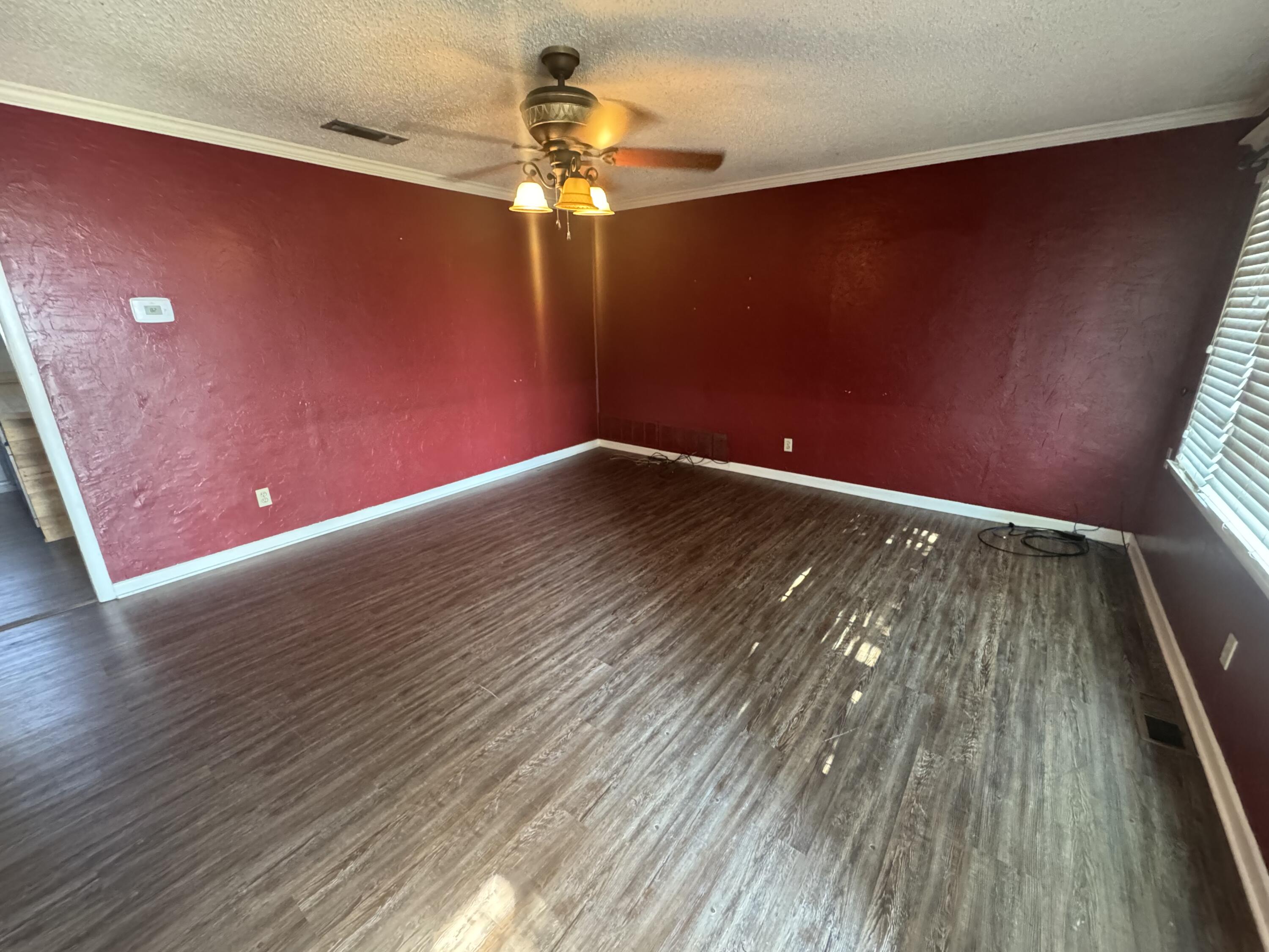 640 Fm 168 Olton, TX 79064 - Photo 4 of 30 a view of empty room with wooden floor