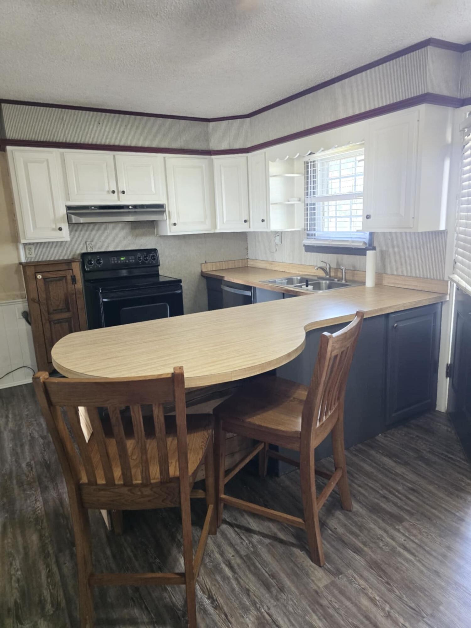640 Fm 168 Olton, TX 79064 - Photo 8 of 30 a kitchen with a dining table chairs sink and cabinets