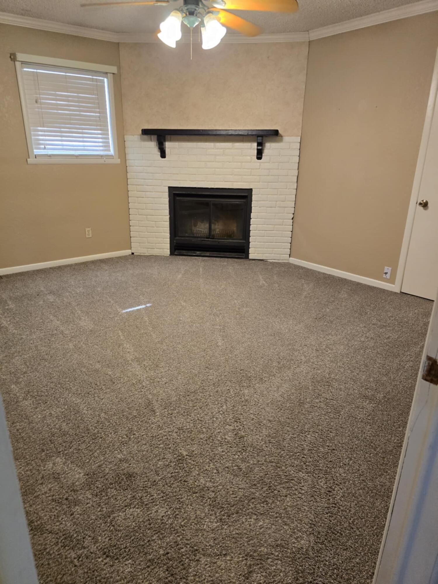 640 Fm 168 Olton, TX 79064 - Photo 9 of 30 a view of empty room with a fireplace