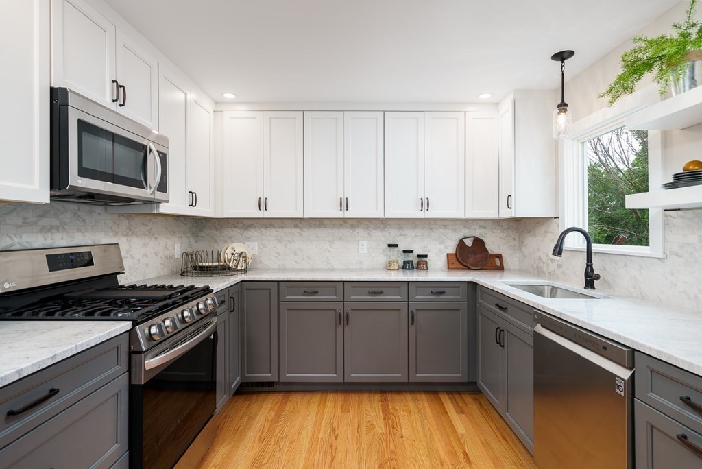 69 High Street Southampton, MA 01073 - Photo 13 of 42 a kitchen with stainless steel appliances granite countertop a sink and cabinets