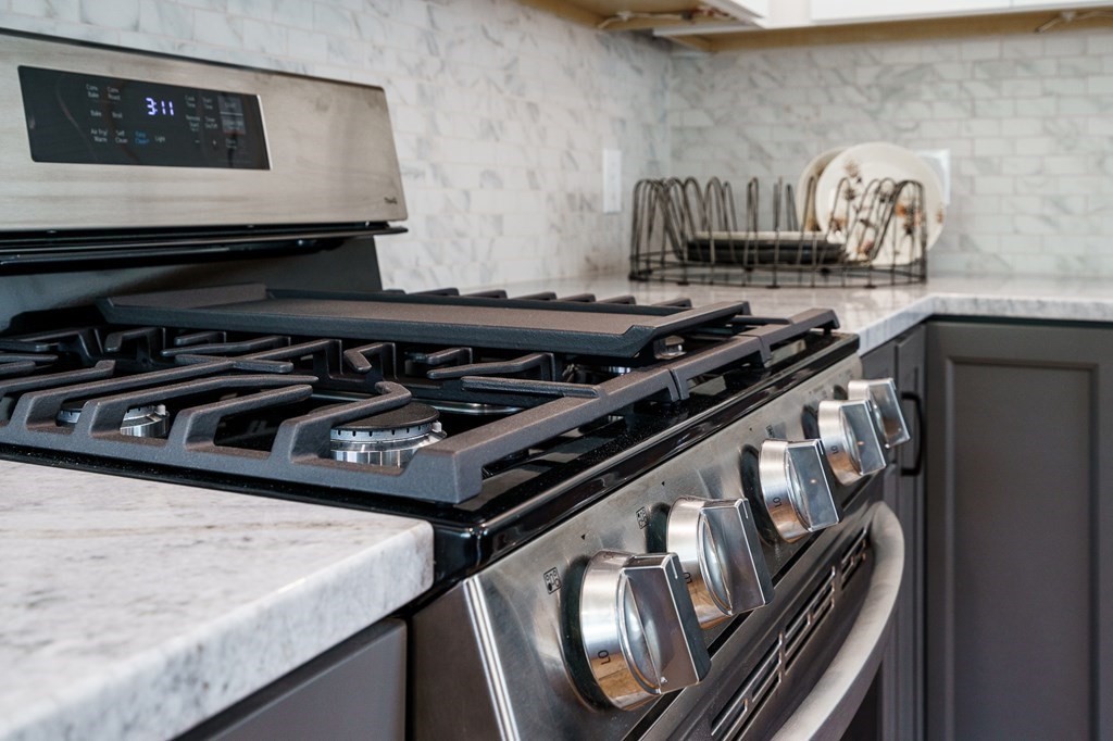 69 High Street Southampton, MA 01073 - Photo 14 of 42 a close view of a stove and a microwave