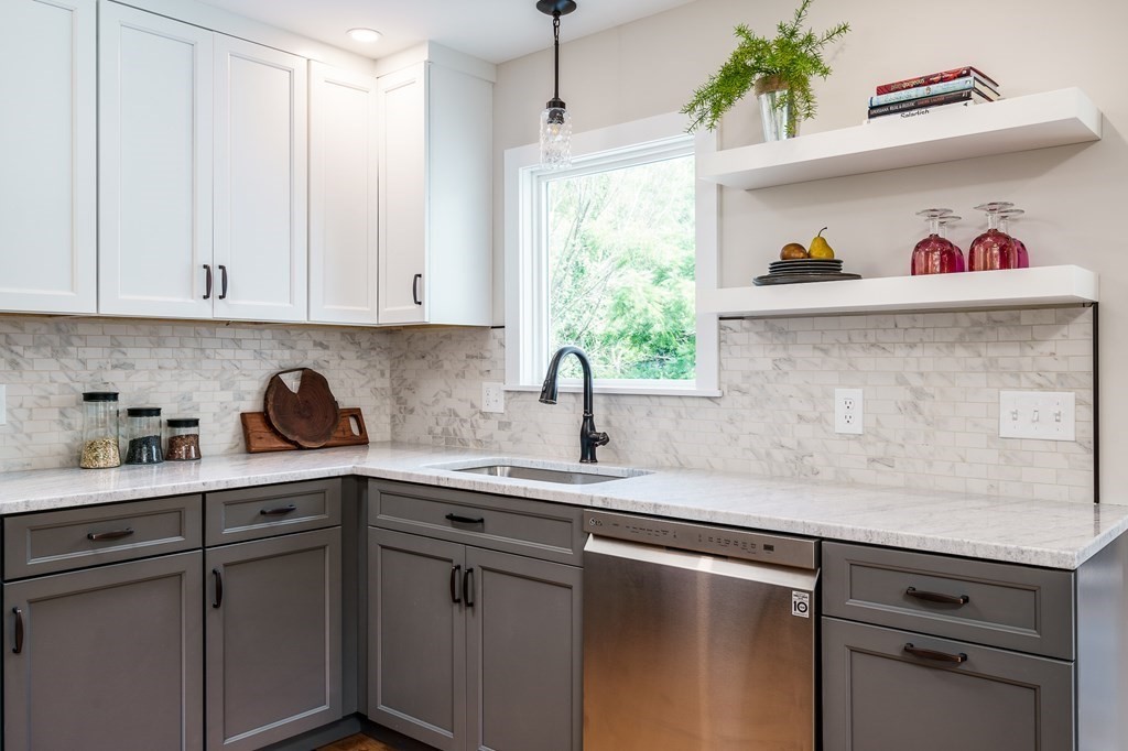 69 High Street Southampton, MA 01073 - Photo 16 of 42 a kitchen with stainless steel appliances granite countertop a sink window and cabinets