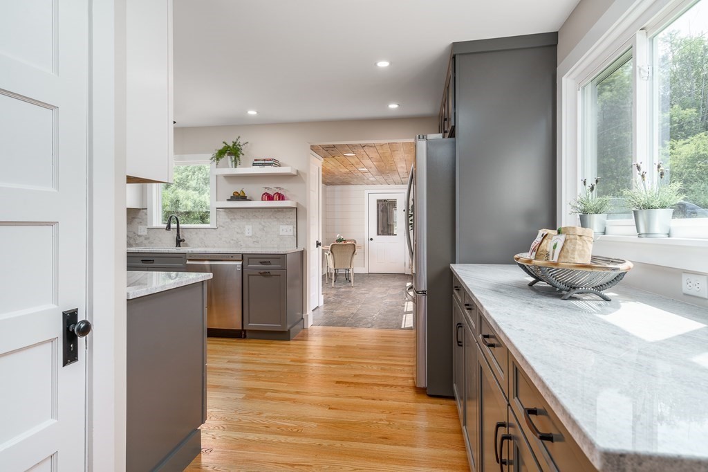 69 High Street Southampton, MA 01073 - Photo 17 of 42 a kitchen with a sink stove and wooden floor
