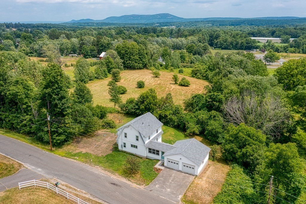 69 High Street Southampton, MA 01073 - Photo 2 of 42 an aerial view of a house with a yard and lake view