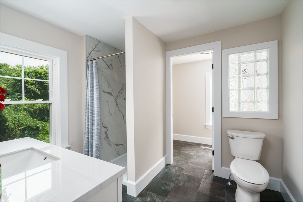 69 High Street Southampton, MA 01073 - Photo 28 of 42 a bathroom with a sink a toilet and shower