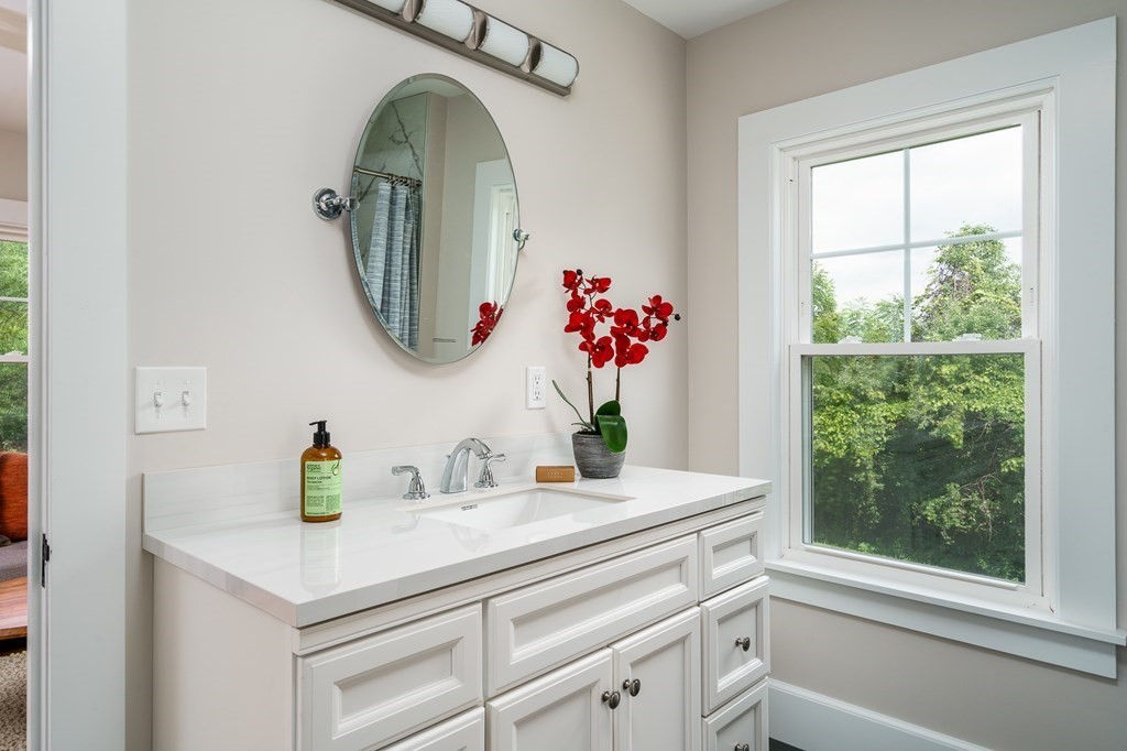69 High Street Southampton, MA 01073 - Photo 29 of 42 a bathroom with a sink mirror and window
