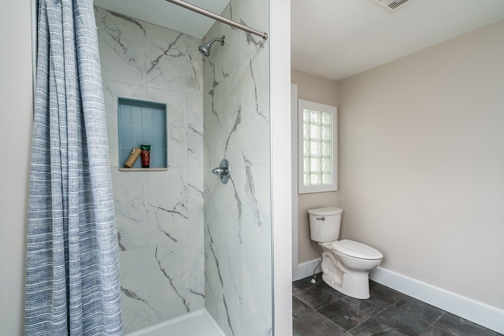 69 High Street Southampton, MA 01073 - Photo 30 of 42 a bathroom with a toilet and a shower