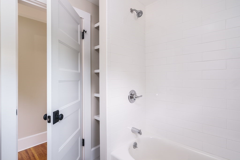 69 High Street Southampton, MA 01073 - Photo 37 of 42 a bathroom with a bathtub and a shower