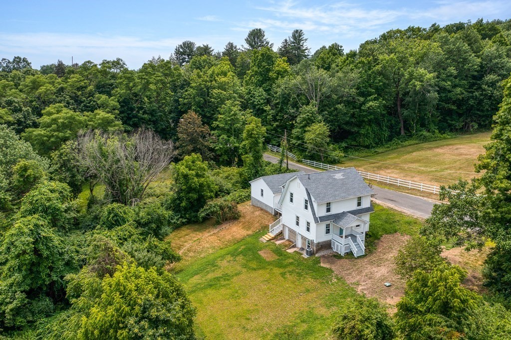 69 High Street Southampton, MA 01073 - Photo 4 of 42 an aerial view of a house with outdoor space and trees all around