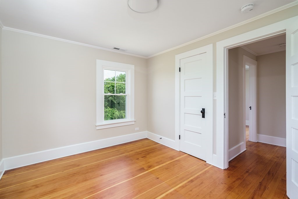 69 High Street Southampton, MA 01073 - Photo 41 of 42 an empty room with wooden floor and windows