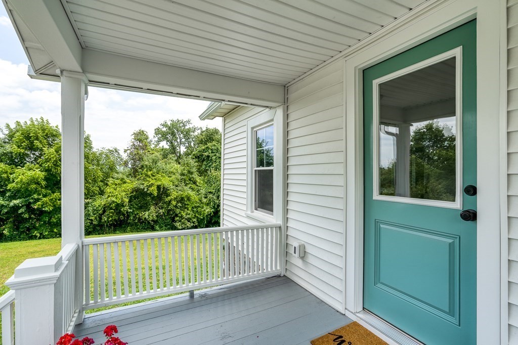 69 High Street Southampton, MA 01073 - Photo 8 of 42 a view of a porch with a floor to ceiling window