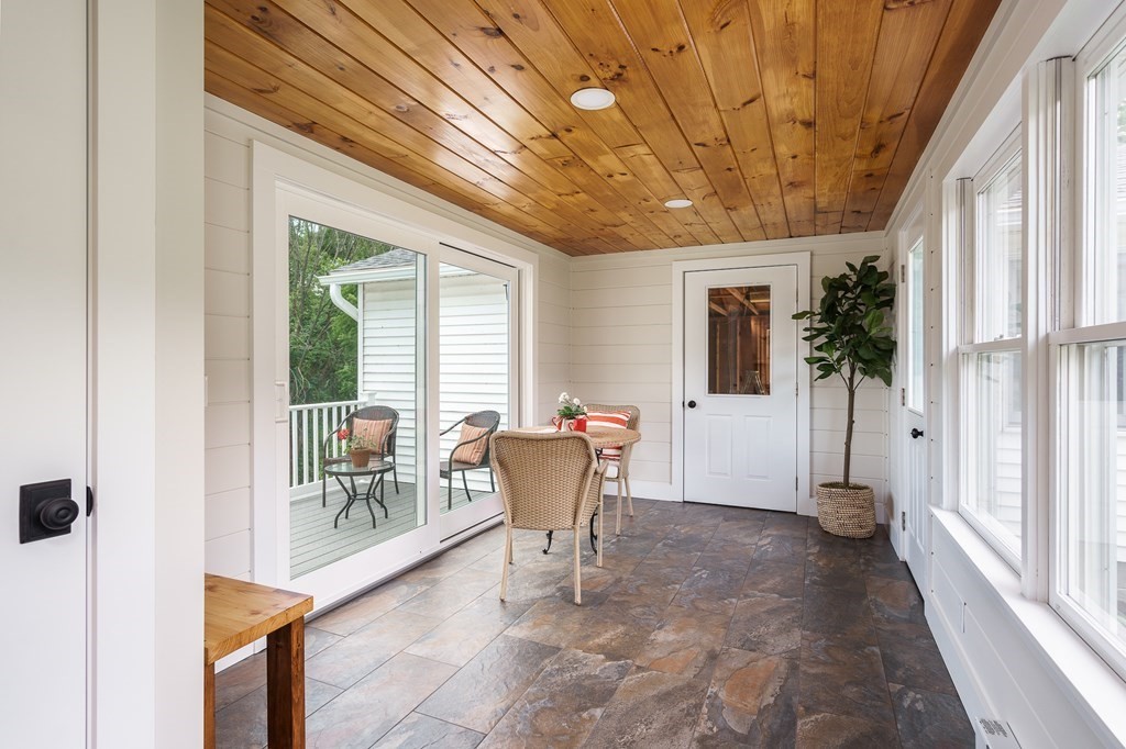 69 High Street Southampton, MA 01073 - Photo 10 of 42 a view of a patio with table and chairs and potted plants