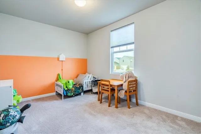 an outdoor dining room with furniture