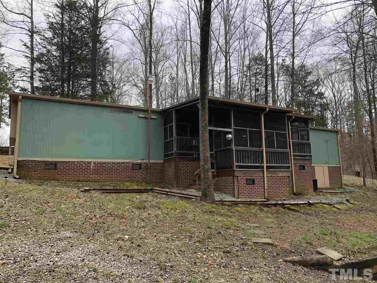 6119 Virgilina Road Roxboro, NC 27574 - Photo 3 of 11 a view of a house with a yard