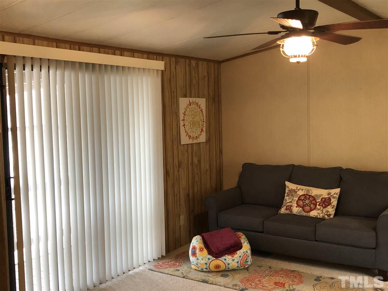 6119 Virgilina Road Roxboro, NC 27574 - Photo 9 of 11 a living room with furniture and a window