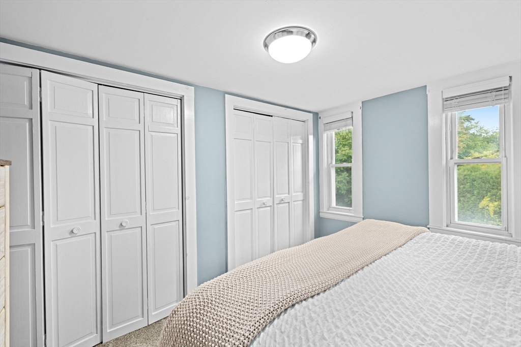 983 Webster Street Hanover, MA 02339 - Photo 27 of 41 a bedroom with a bed and a window