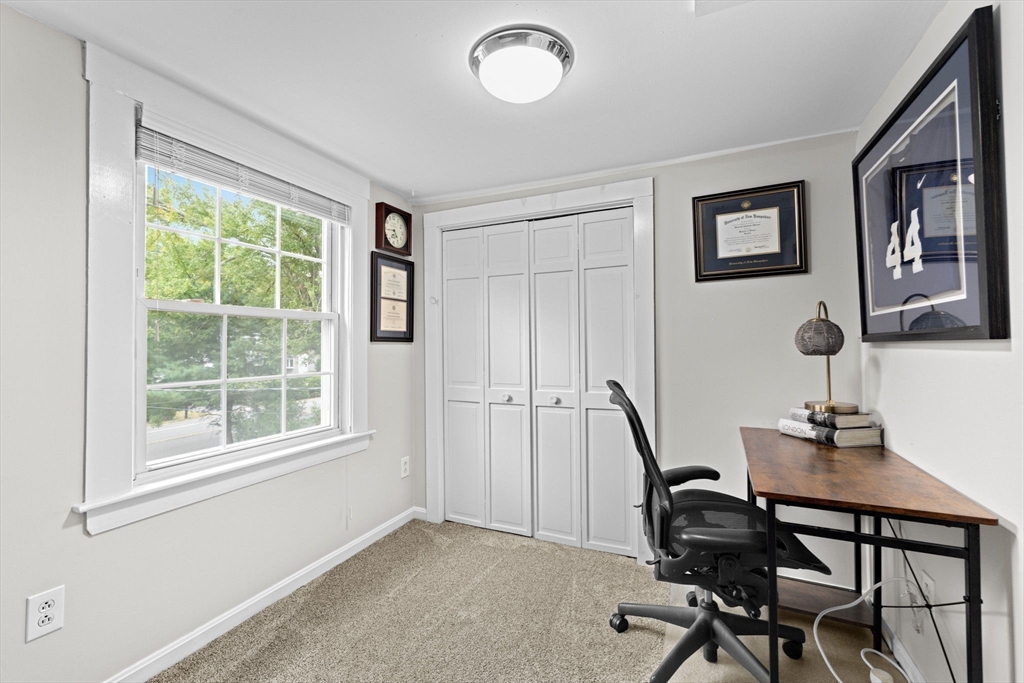 983 Webster Street Hanover, MA 02339 - Photo 30 of 41 a view of a workspace with furniture and a window
