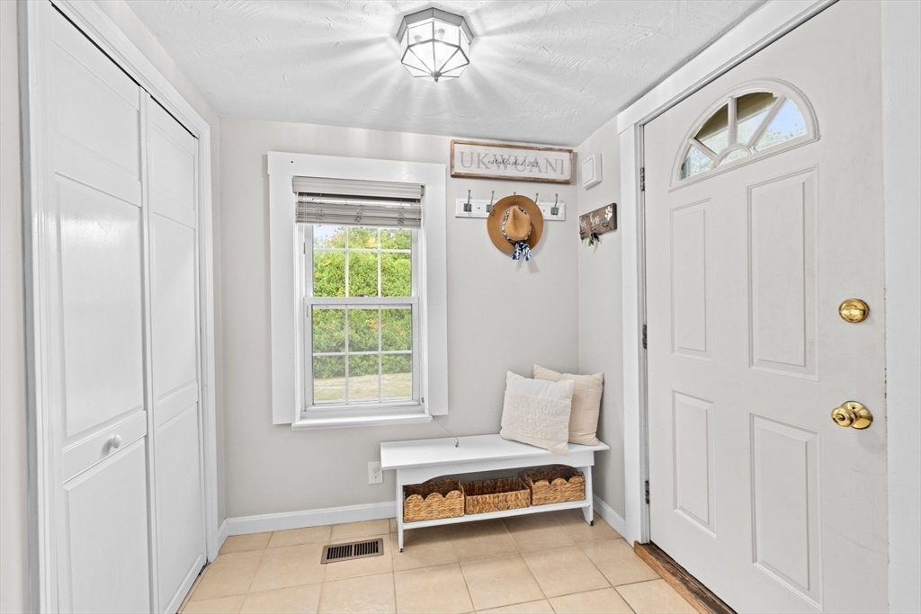 983 Webster Street Hanover, MA 02339 - Photo 3 of 41 a view of livingroom with furniture and window
