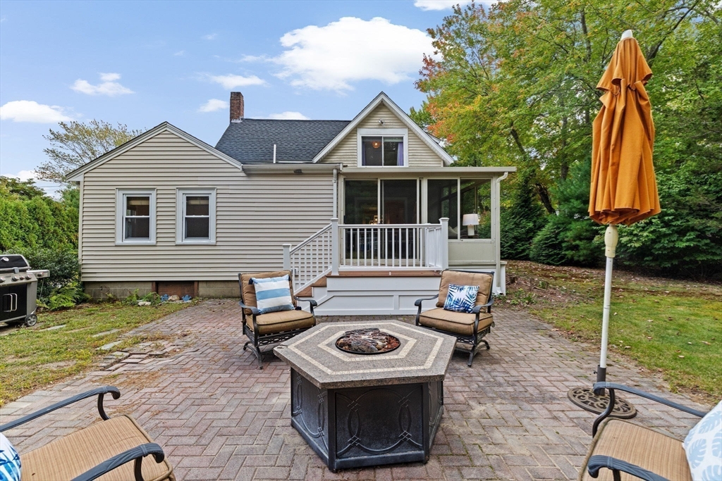 983 Webster Street Hanover, MA 02339 - Photo 33 of 41 a front view of a house with a yard
