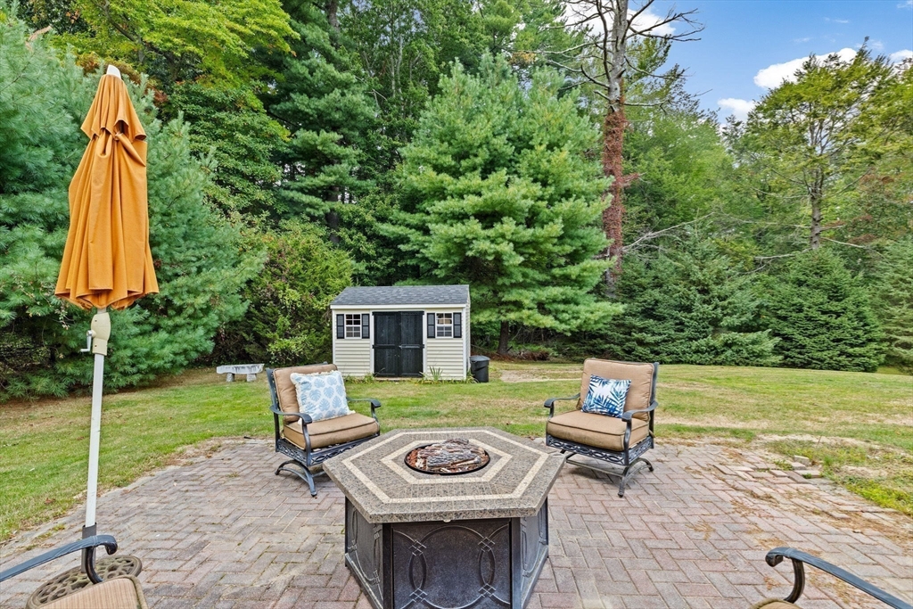 983 Webster Street Hanover, MA 02339 - Photo 34 of 41 a view of a backyard with furniture and a garden