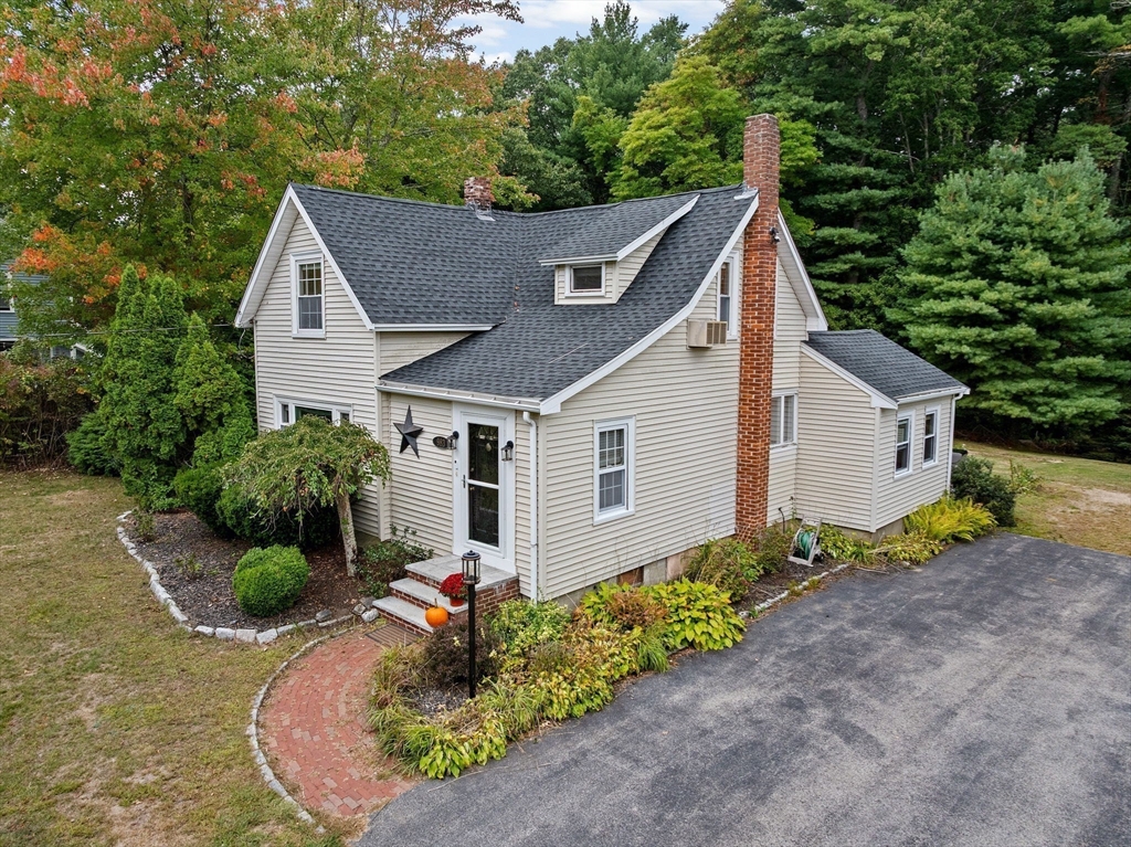 983 Webster Street Hanover, MA 02339 - Photo 38 of 41 a front view of house with yard and trees around