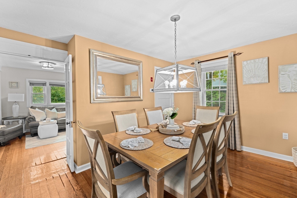 983 Webster Street Hanover, MA 02339 - Photo 8 of 41 a dining room with furniture a chandelier and wooden floor