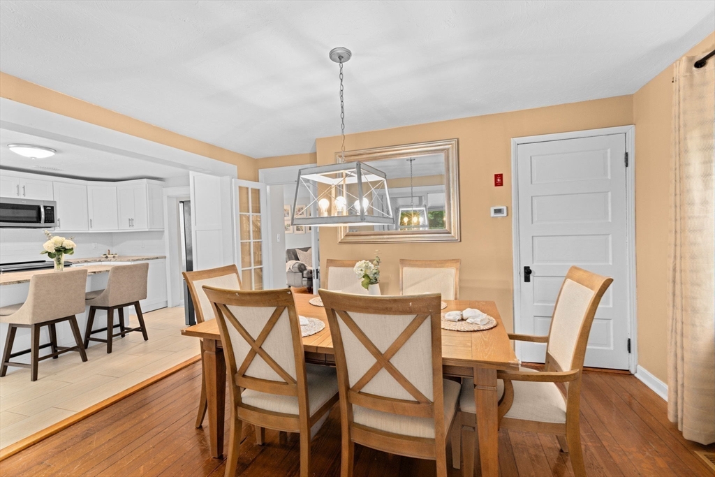 983 Webster Street Hanover, MA 02339 - Photo 9 of 41 a dining room with furniture and wooden floor