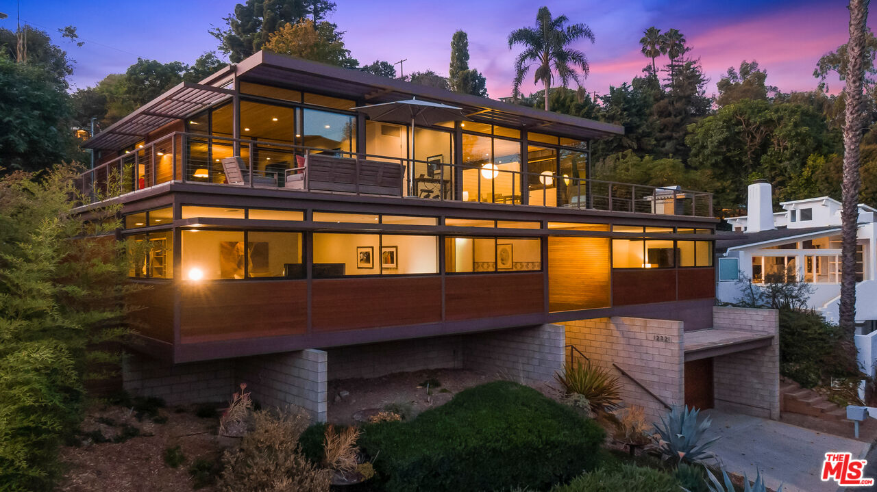 12321 Rochedale Lane Los Angeles, CA 90049 - Photo 2 of 46 a front view of a house with a yard