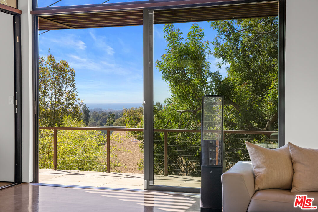 12321 Rochedale Lane Los Angeles, CA 90049 - Photo 12 of 46 a view of a city from a balcony