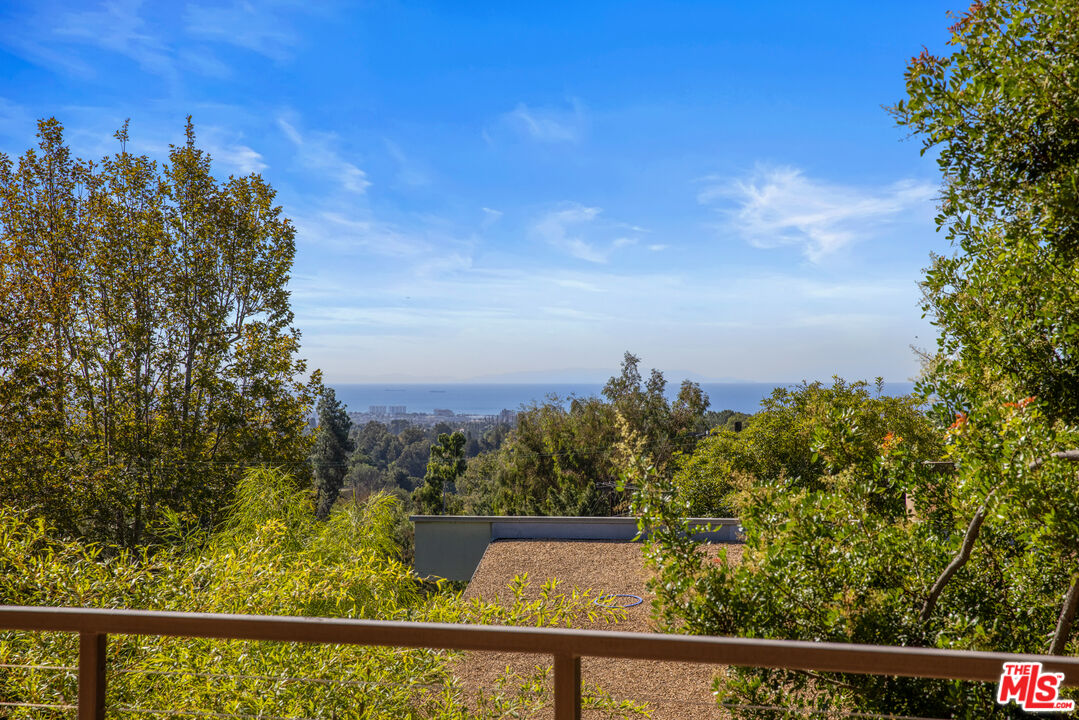 12321 Rochedale Lane Los Angeles, CA 90049 - Photo 13 of 46 a view of a lake from a balcony