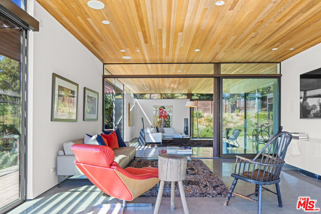 12321 Rochedale Lane Los Angeles, CA 90049 - Photo 17 of 46 a view of a dining room with furniture window and outside view