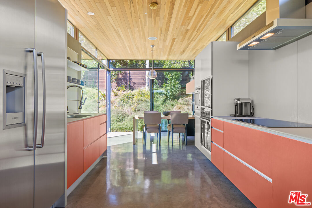 12321 Rochedale Lane Los Angeles, CA 90049 - Photo 21 of 46 a view of a dining room with furniture window and outside view