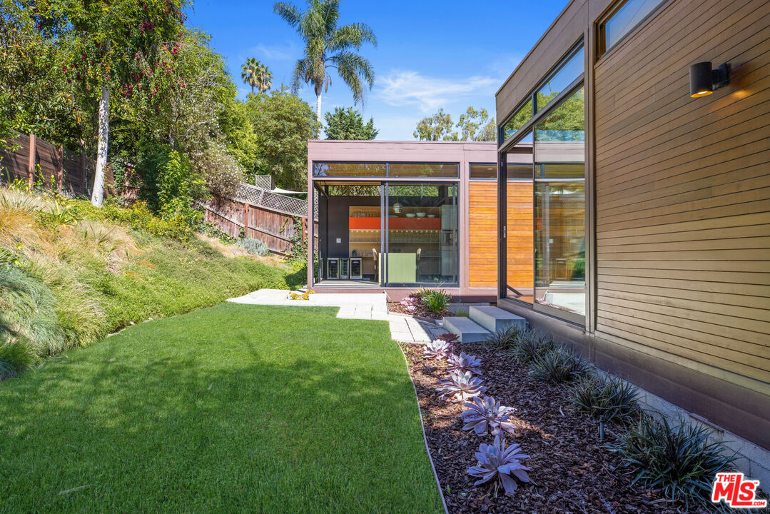 12321 Rochedale Lane Los Angeles, CA 90049 - Photo 23 of 46 a front view of a house with garden