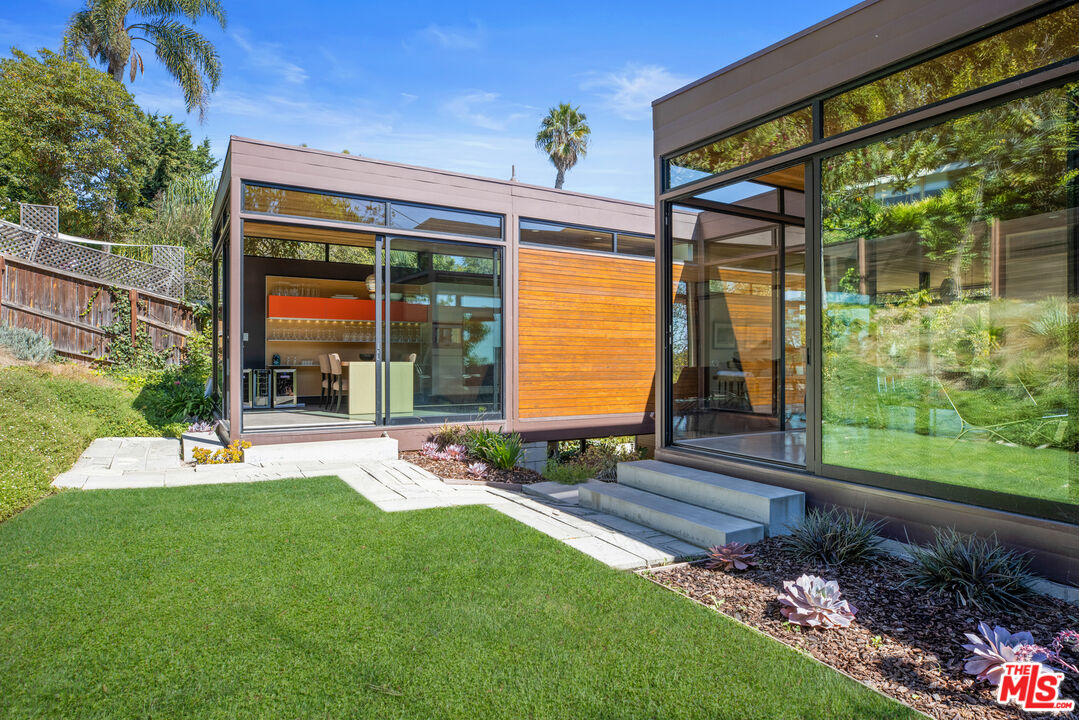 12321 Rochedale Lane Los Angeles, CA 90049 - Photo 24 of 46 a view of a backyard with a patio