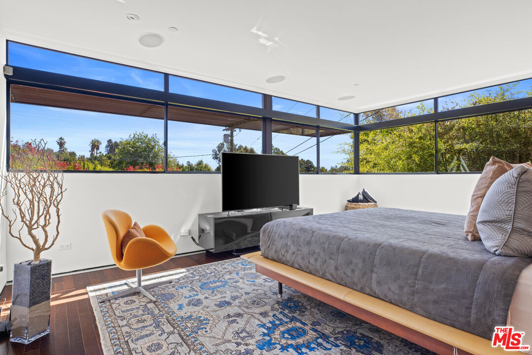 12321 Rochedale Lane Los Angeles, CA 90049 - Photo 26 of 46 a living room with a couch and a table