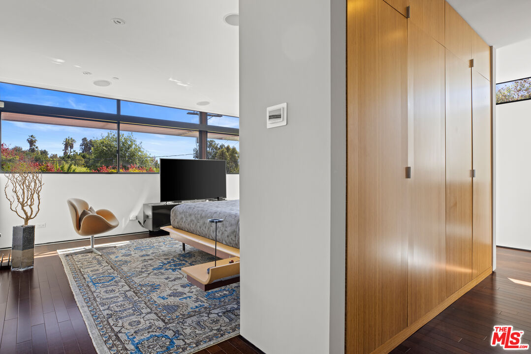 12321 Rochedale Lane Los Angeles, CA 90049 - Photo 28 of 46 a bed room with furniture and wooden floor